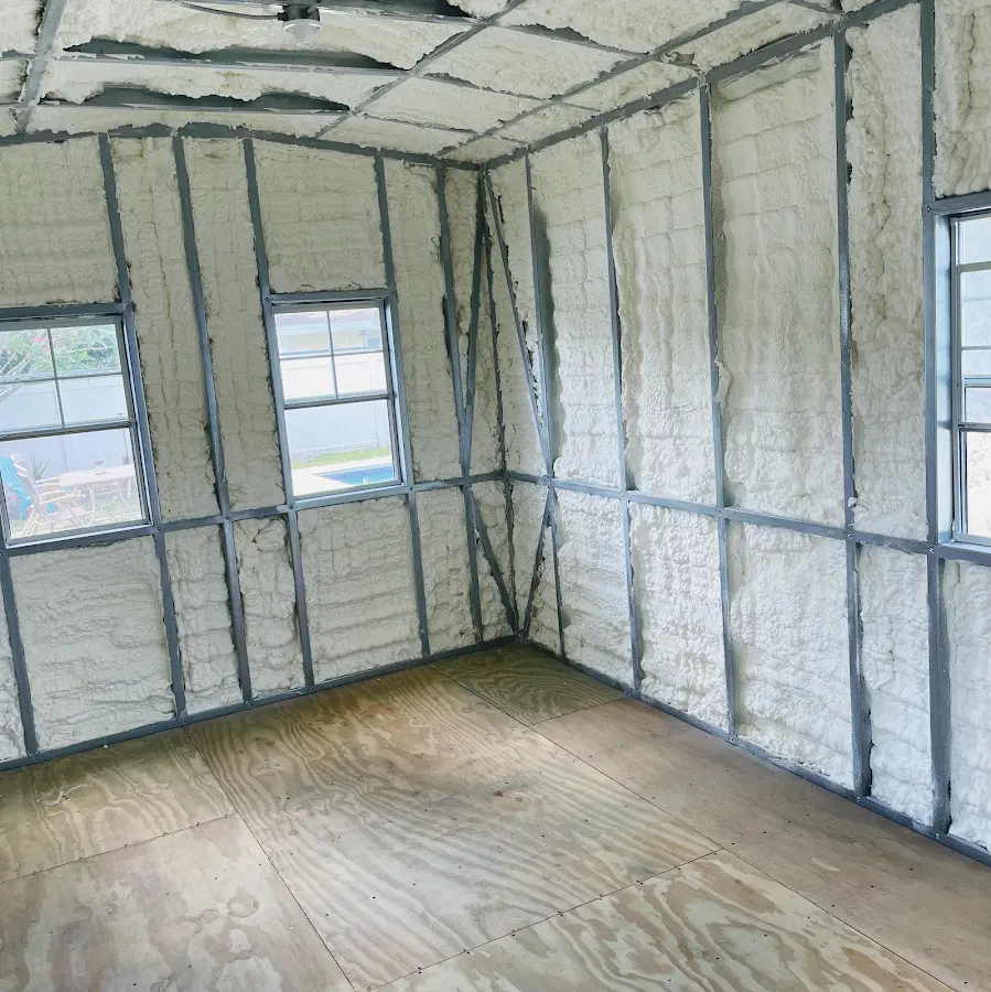 Closed-cell spray foam insulation applied to wall cavities in a residential project in Lonsdale